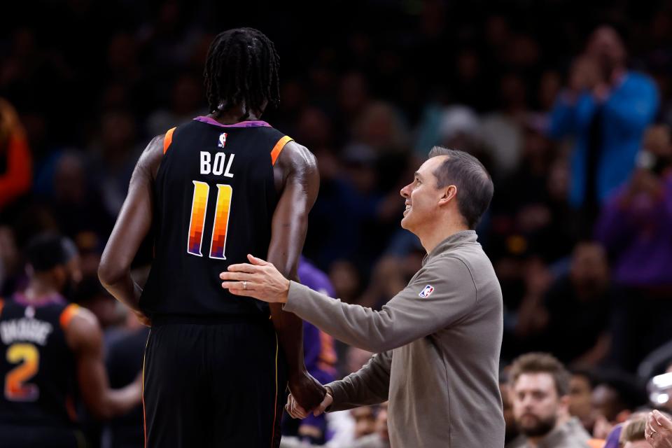 Head coach Frank Vogel of the Phoenix Suns shakes hands with Bol Bol #11 during the first half against the Portland Trail Blazers at Footprint Center on January 01, 2024 in Phoenix, Arizona.