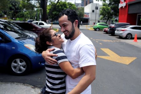 Hugo San Jose, 24, greets his mother Lilian Diaz after being deported from the United States to Guatemala, ahead of Sunday's presidential election in Guatemala City