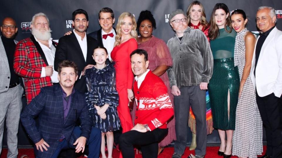 The cast and crew of “I Beleive in Santa” at the film’s premiere on the Warner Bros. lot in Burbank, including (left to right) Mark W. Gray, Sachin Bhatt, star and screenwriter John Ducey, Violet McGraw, star/producer Christina Moore, director Alex Ranarivelo (in the red sweater), Lateefah Moore, Missi Pyle, Meredith Pyle and producer Ali Afshar celebrate Christmas early at the premiere of “I Believe in Santa” at Warner Bros. Studios in Burbank. (Helen Rezvan)