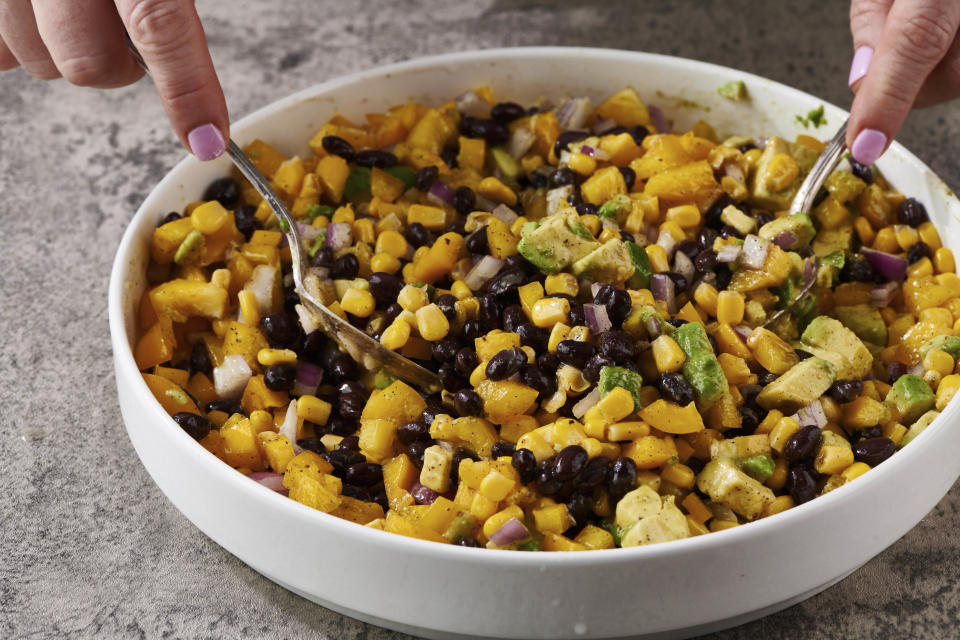 This image shows a vegetarian recipe for Black Bean and Corn Salad, a nourishing, protein-filled, meat-free meal for lunch. (Cheyenne M. Cohen via AP)