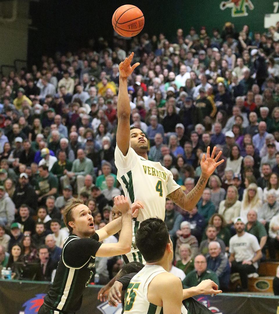 Vermont's Kam Gibson rises up and scores on a floater during the Catamounts 79-57 win over Binghamton in the America East semifinals on Tuesday night at Patrick Gym.