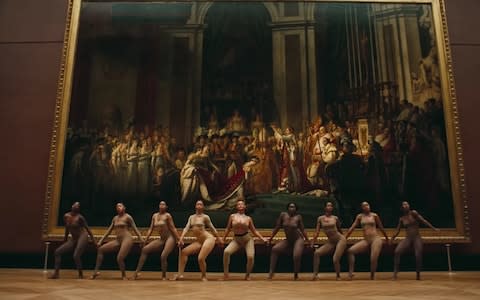 Still from Beyoncé and Jay-Z's Apeshit video before Jacques Louis David's The Coronation of Napoleon - Credit: Telegraph