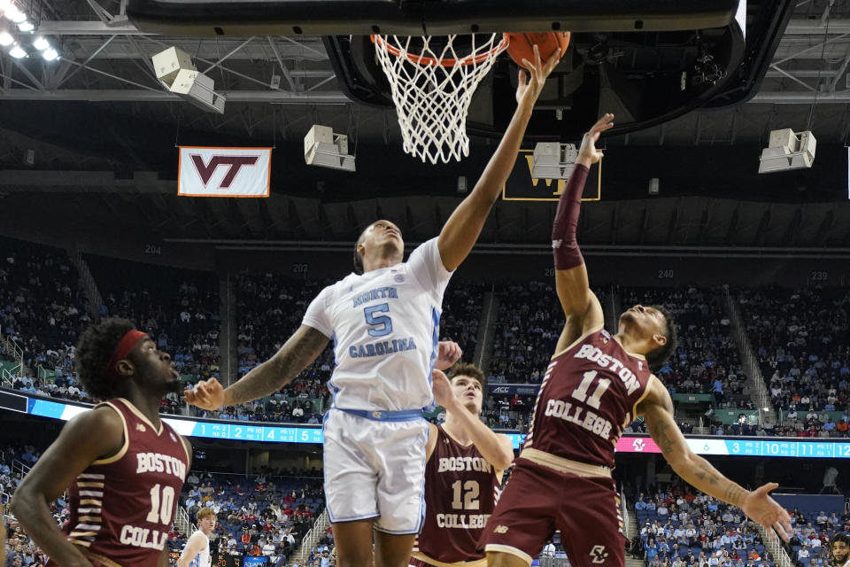 North Carolina forward Armando Bacot (5) shoots against Boston College guard Makai Ashton-Langford (11) during the first half of an NCAA college basketball game at the Atlantic Coast Conference Tournament in Greensboro, N.C., Wednesday, March 8, 2023. (AP Photo/Chuck Burton)