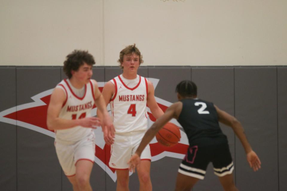 Tate Perrin brings the ball down the floor during the postseason opener against Des Moines North on Monday, Feb. 20, 2023, in Grimes.