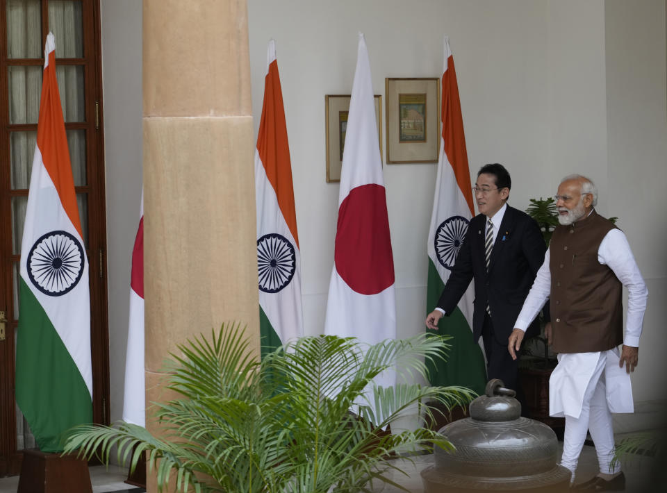 Indian Prime Minister Narendra Modi, right, with his Japanese counterpart Fumio Kishida arrive for their meeting in New Delhi, India, Monday, March 20, 2023. (AP Photo/Manish Swarup)