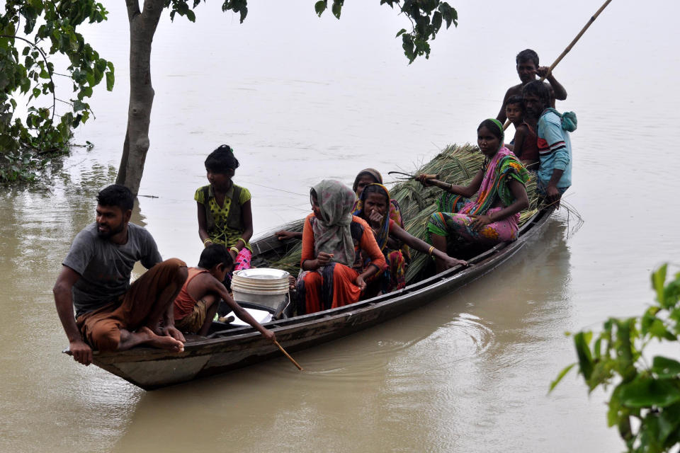 DARRANG,INDIA-JULY 21,2020 :Flood affected villagers are transported on a boat towards a safer place at Puthimari village in Darrang District of Assam ,India - PHOTOGRAPH BY Anuwar Ali Hazarika / Barcroft Studios / Future Publishing (Photo credit should read Anuwar Ali Hazarika/Barcroft Media via Getty Images)