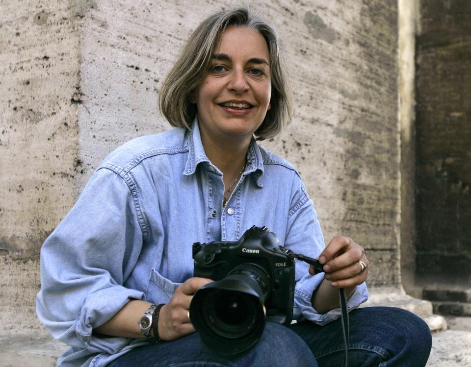 FILE - In this Thursday, April 2005 file photo, Associated Press photographer Anja Niedringhaus poses for a photograph in Rome. Niedringhaus, 48, was killed and an AP reporter was wounded on Friday, April 4, 2014 when an Afghan policeman opened fire while they were sitting in their car in eastern Afghanistan. Niedringhaus an internationally acclaimed German photographer, was killed instantly, according to an AP Television freelancer who witnessed the shooting. Kathy Gannon, the reporter, was wounded twice and is receiving medical attention. (AP Photo/Peter Dejong, File)