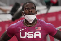 Trayvon Bromell, of United States, finishes a heat in the men's 100-meter run at the 2020 Summer Olympics, Saturday, July 31, 2021, in Tokyo. (AP Photo/Charlie Riedel)