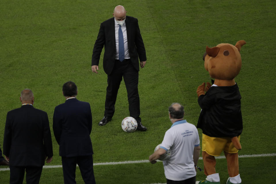 FIFA president Gianni Infantino plays with a ball prior to the Copa America final soccer match between Brazil and Argentina at the Maracana stadium in Rio de Janeiro, Brazil, Saturday, July 10, 2021. (AP Photo/Silvia Izquierdo)