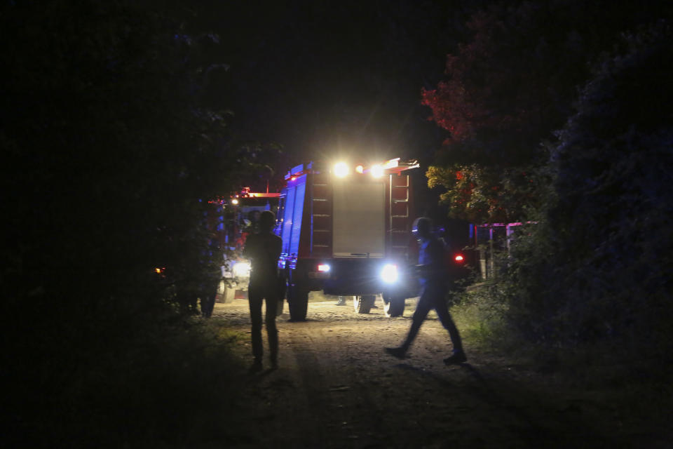 Firefighting vehicles are seen near the site of a plane crash, a few miles away from the city of Kavala, in northern Greece, on Saturday, July 16, 2022. Greek authorities said an Antonov plane, which was headed from Serbia to Jordan, crashed near the city of Kavala on Saturday, but authorities have not been able to confirm whether it was a passenger or cargo flight, or how many people were on the plane. (Ilias Kotsireas/InTime News via AP)