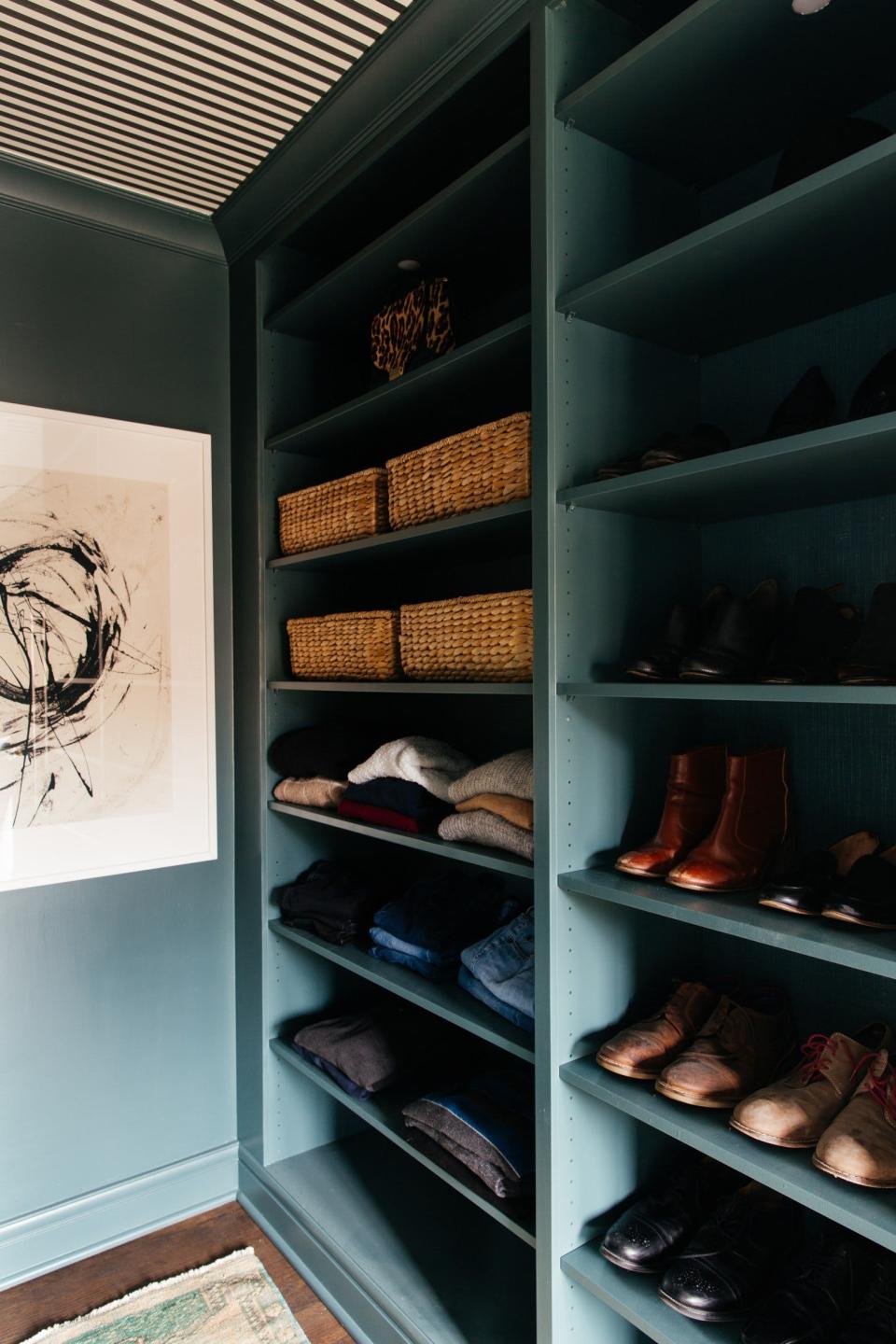 A blue walk-in closet