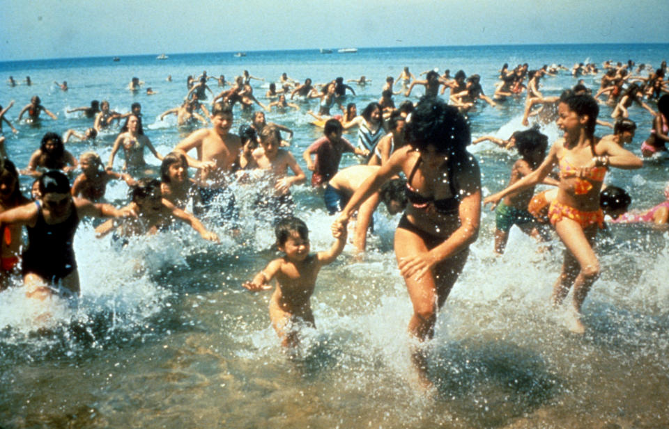 Crowds run out of the water in a scene from the film 'Jaws', 1975. (Universal / Getty Images)