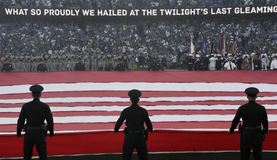 <p>General view during the singing of the national anthem before game one of the 2017 World Series between the Los Angeles Dodgers and the Houston Astros at Dodger Stadium. Mandatory Credit: Robert Hanashiro-USA TODAY Sports </p>