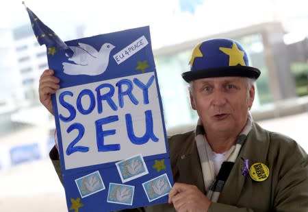 An anti-Brexit protester demonstrates outside the EU commission in Brussels