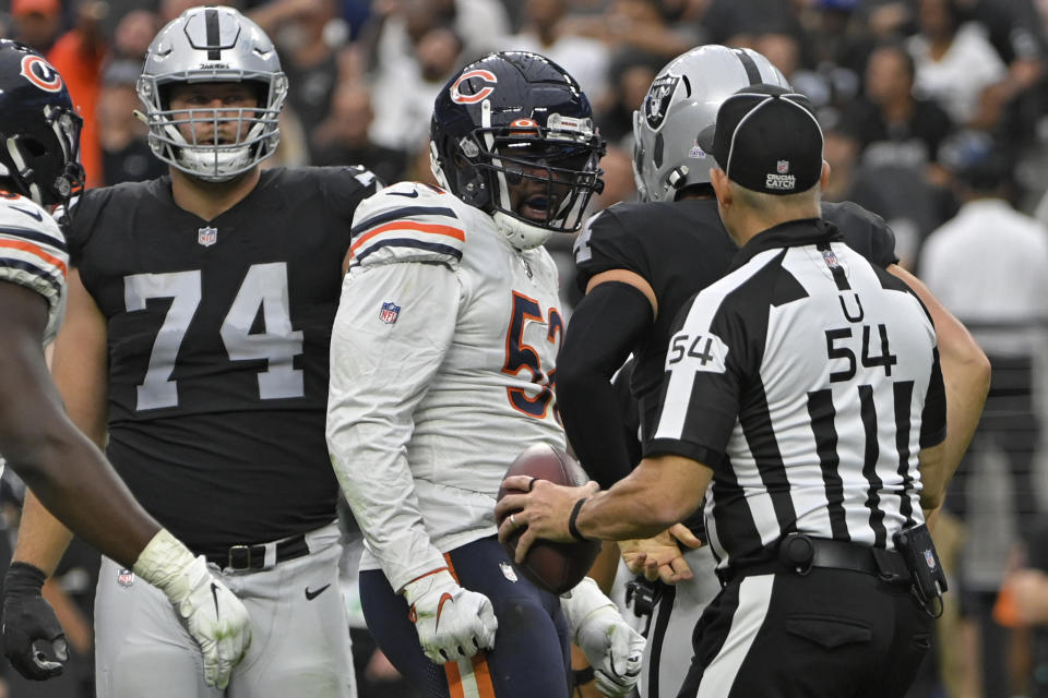 Chicago Bears outside linebacker Khalil Mack (52) reacts after sacking Las Vegas Raiders quarterback Derek Carr (4) during the first half of an NFL football game, Sunday, Oct. 10, 2021, in Las Vegas. (AP Photo/David Becker)