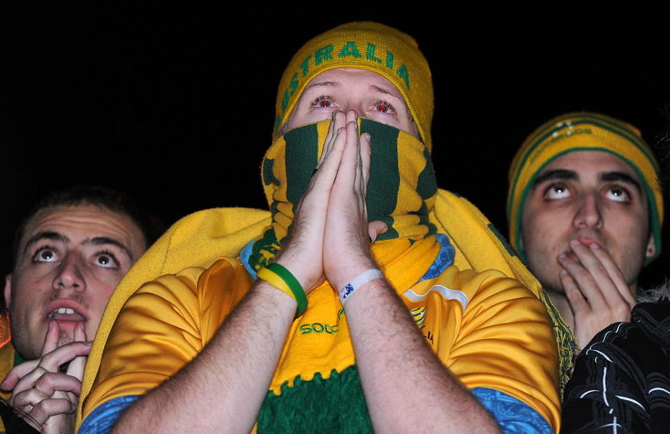 Socceroos fans react in anguish as they watch a big screen broadcast of the Australia v Ghana football World Cup match at the FIFA fan fest site in Sydney on June 20, 2010.