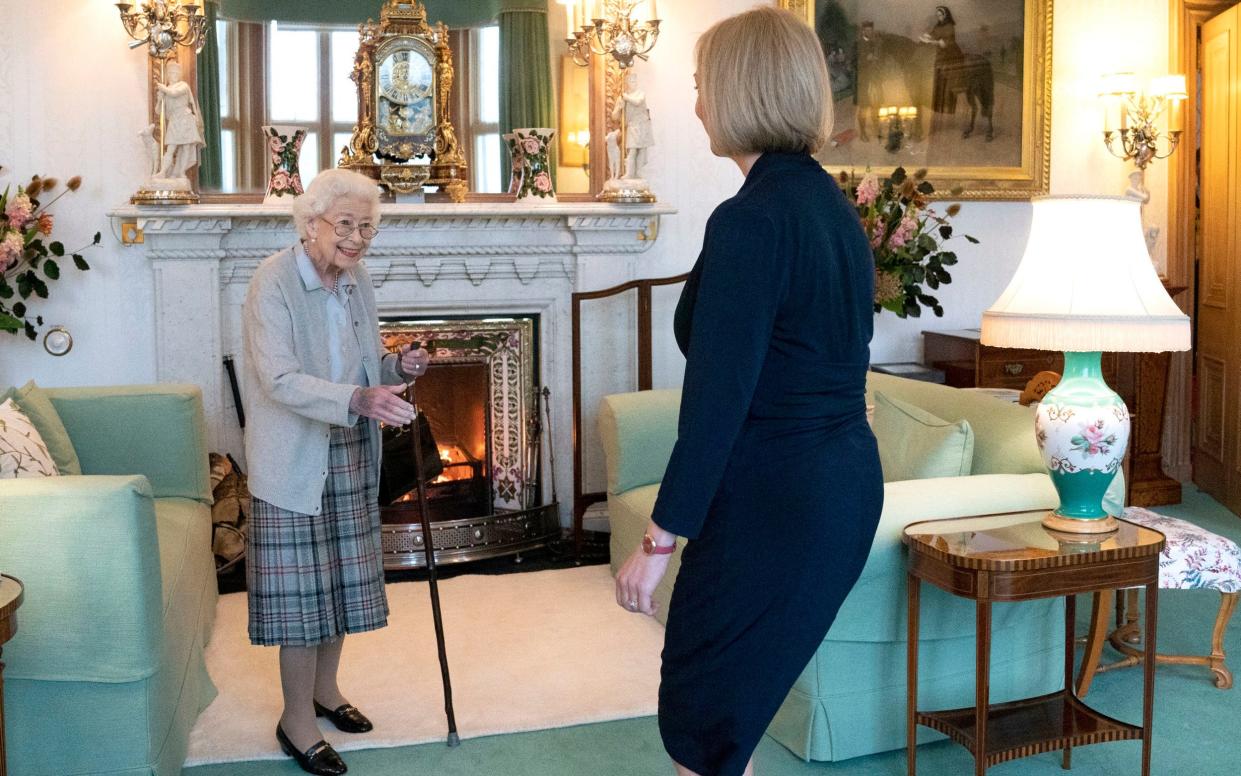 Queen Elizabeth stands to welcome Liz Truss