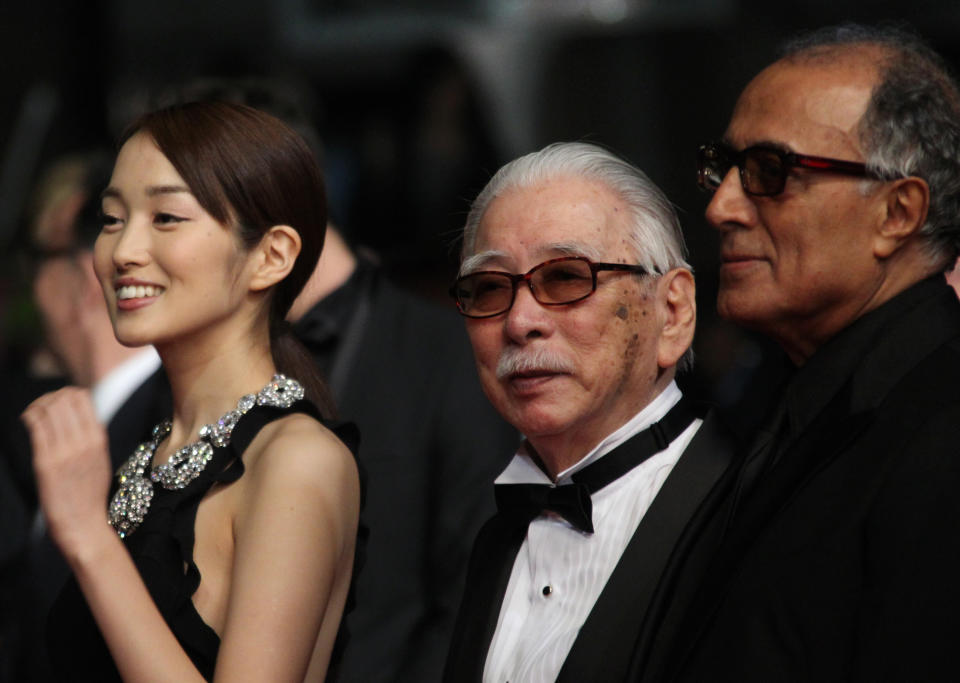 From left, actors Rin Takanashi, Tadashi Okuno and director Abbas Kiarostami arrive for the screening of Like Someone in Love at the 65th international film festival, in Cannes, southern France, Monday, May 21, 2012. (AP Photo/Joel Ryan)