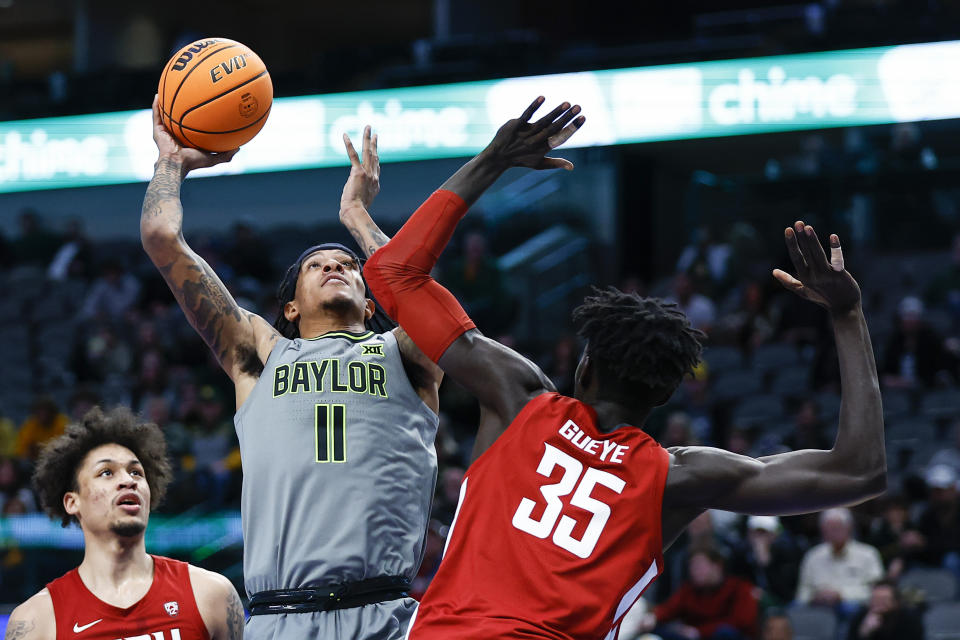 Baylor forward Jalen Bridges (11) attempts to shoot as Washington State forward Mouhamed Gueye (35) defends during the first half of an NCAA college basketball game on Sunday, Dec. 18, 2022, in Dallas. (AP Photo/Brandon Wade)