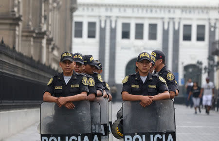 Peruvian police guard near the Government Palace in Lima, Peru March 21, 2018. REUTERS/Guadalupe Pardo