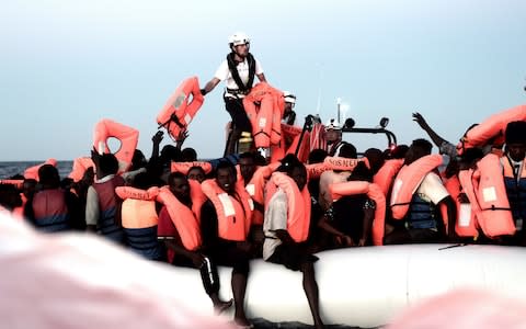 Migrants are rescued by staff members of the MV Aquarius, a search and rescue ship in the central Mediterranean Sea - Credit: Reuters