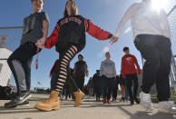 <p>Students, from left, Nariah Marzka, 14; Morgan Orelski, 15, and Travis Burge, 15, who joined about 500 students, leave leave Keck Field after taking part in a national school walkout event to protest gun violence and honor shooting victims at Fairview High School in Fairview Township, Erie County, Pa., Friday April 20, 2018. (Photo: Christopher Millette/Erie Times-News via AP) </p>