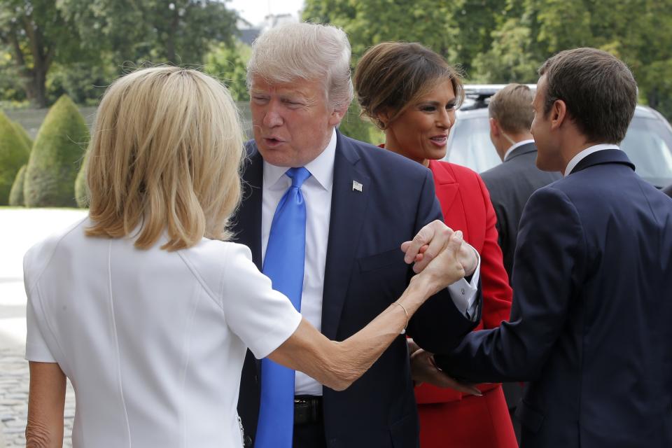 <p>French President Emmanuel Macron, right, welcome First Lady Melania Trump while and his wife Brigitte, left, welcomes President Donald Trump at Les Invalides museum in Paris Thursday, July 13, 2017. (Photo: Michel Euler/AP) </p>