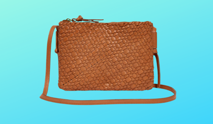 A woven light brown crossbody purse