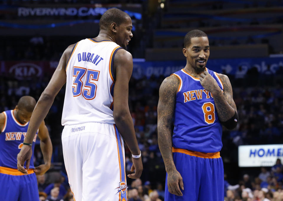 Oklahoma City Thunder forward Kevin Durant (35) talks to New York Knicks guard J.R. Smith (8) as Smith waits to take a foul shot in the second quarter of an NBA basketball game in Oklahoma City, Sunday, Feb. 9, 2014. (AP Photo/Sue Ogrocki)