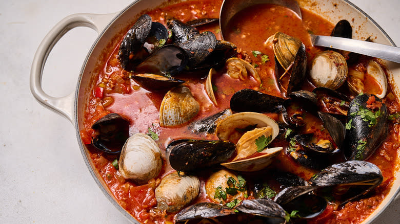 mussels and clams cooked in tomato broth with cilantro