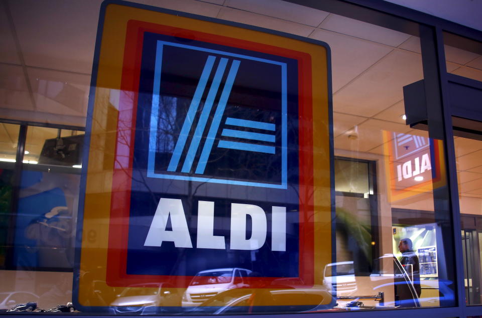 A customer walks into the German discount supermarket ALDI in Sydney, Australia June 19, 2015. Fresh fruit and vegetables are the new frontline in ALDI Inc's assault on Australia's $70 billion supermarket sector, as the German discounter looks to beat the most profitable duopoly in global groceries at their own game. For the first time, ALDI's Australian arm plans to ship fruit and vegetables direct from farms in Australia to its stores, according to one major fruit supplier, removing the only competitive advantage for incumbent heavyweights Woolworths Ltd and Wesfarmers-owned Coles.      REUTERS/David Gray