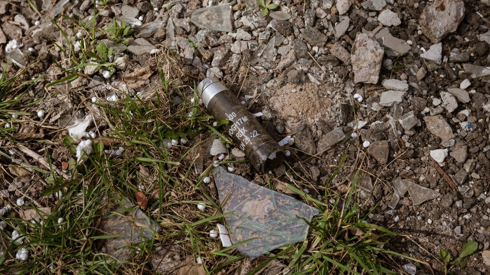 AVDIIVKA, UKRAINE - MARCH 23: Cluster bomb capluse is seen on the ground amid Russia-Ukraine war at the frontline city of Avdiivka, Ukraine on March 23, 2023. Around 2000 people are left in the town and volunteers enter the town daily although the war continues. (Photo by Andre Luis Alves/Anadolu Agency via Getty Images) - Andre Luis Alves/Anadolu Agency/Getty Images