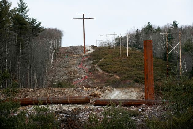 A partially completed tower and a finished tower are seen in a section of the transmission line along Route 201 in Bingham, Maine, last November. (Photo: Portland Press Herald via Getty Images)