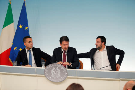 Italy's Minister of Labor and Industry Luigi Di Maio, Prime Minister Giuseppe Conte and Interior Minister Matteo Salvini attend a news conference after a cabinet meeting at Chigi Palace in Rome, Italy, October 20 2018. REUTERS/Remo Casilli