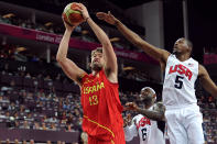 LONDON, ENGLAND - AUGUST 12: Marc Gasol #13 of Spain drives past Kevin Durant #5 of the United States to score during the Men's Basketball gold medal game between the United States and Spain on Day 16 of the London 2012 Olympics Games at North Greenwich Arena on August 12, 2012 in London, England. (Photo by Harry How/Getty Images)