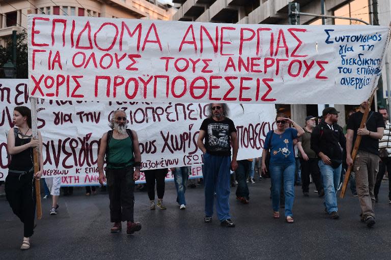 Protesters march in Athens on May 8, 2015 demanding jobs and allowances for the unemployed