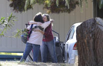 <p>Two women embrace outside Rancho Tehama Elementary School, where a gunman opened fire Tuesday, Nov. 14, 2017, in Corning, Calif. Authorities said, a gunman choosing targets at random, opened fire in a rural Northern California town Tuesday, killing four people at several sites and wounding others at the elementary school before police shot him dead. (AP Photo/Rich Pedroncelli) </p>