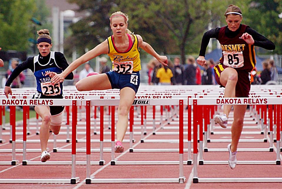 Rosholt-Fairmount’s Conner Anderson (left) leads De Smet’s Christa Koeller to the finish line in the Class B girls’ 100-meter hurdles finals during the 2011 State High School Track and Field Meet at Sioux Falls. Anderson swept the hurdle races for the third-straight year and led Rosholt-Fairmount to its fourth consecutive state runner-up finish.