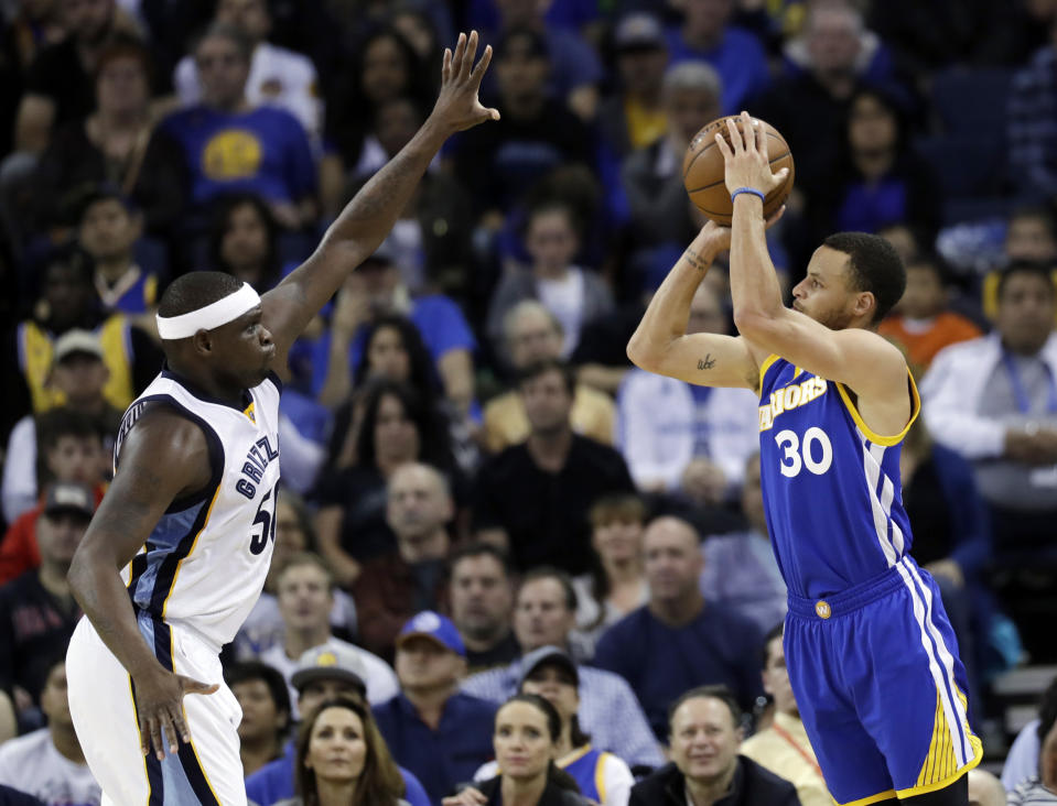 Golden State Warriors' Stephen Curry (30) shoots over Memphis Grizzlies' Zach Randolph during the first half of an NBA basketball game Sunday, March 26, 2017, in Oakland, Calif. (AP Photo/Marcio Jose Sanchez)