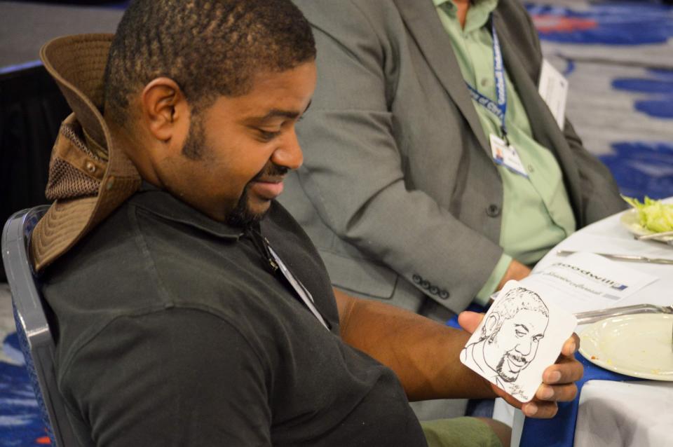 Goodwill Industries of Central Florida reception honors over 200 employees with guest speakers and a caricature artist.