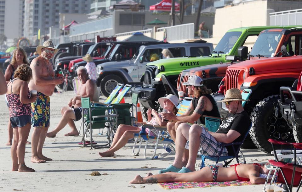 Jeep fans bask in the sun on the beach behind Hard Rock Hotel at last year's Jeep Beach. There's also sunshine in the forecast for this year's event, according to the National Weather Service.