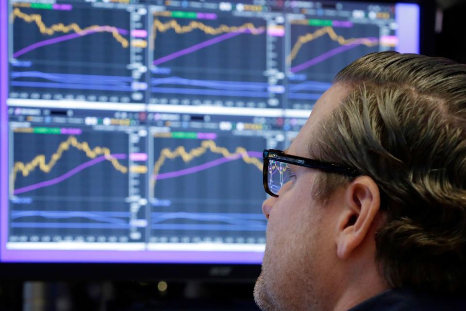 FILE - In this Monday, Dec. 4, 2017, file photo, specialist Gregg Maloney works at his post on the floor of the New York Stock Exchange. The stock market had a banner year overall, but there were plenty of big winners, and big losers, among individual U.S. companies in 2017. (AP Photo/Richard Drew, File) ORG XMIT: NYBZ352