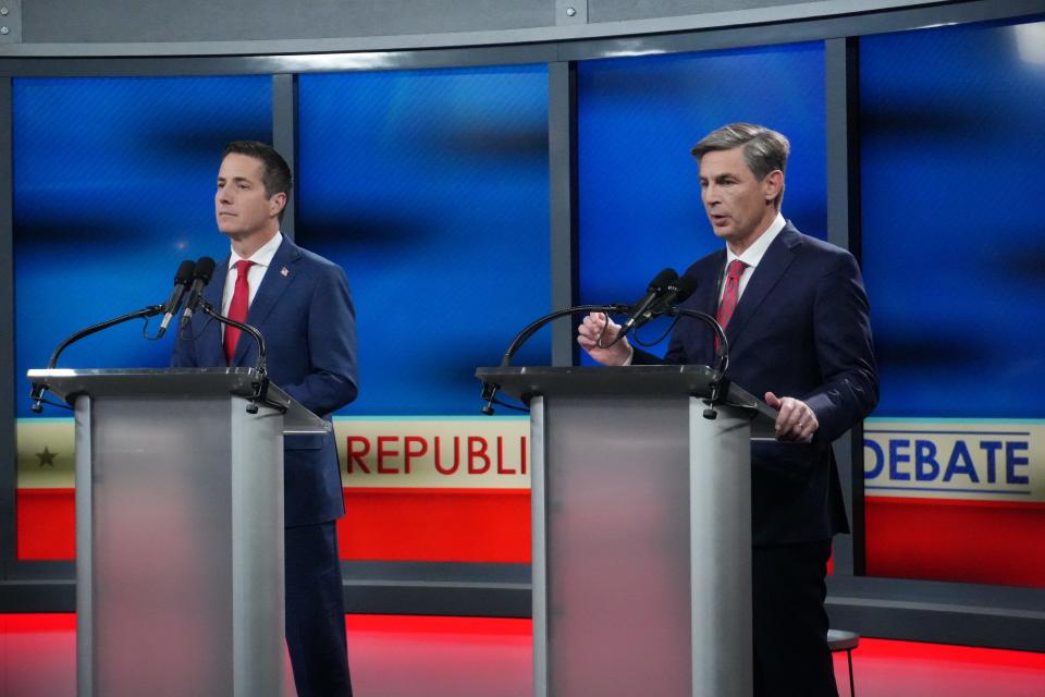 Cleveland businessman Bernie Moreno and state Sen. Matt Dolan take part in a Republican debate at Fox 8 studio in Cleveland on Jan. 22.