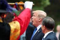 <p>President Donald Trump, center, and Moon Jae-in, South Korea’s president, walk past an honor guard during a welcoming ceremony at the presidential Blue House in Seoul, South Korea, on Tuesday, Nov. 7, 2017. (Photo: SeongJoon Cho/Bloomberg via Getty Images </p>