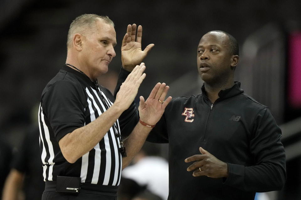 Boston College head coach Earl Grant talks to an official during the first half of an NCAA college basketball game against Loyola Chicago Thursday, Nov. 23, 2023, in Kansas City, Mo. (AP Photo/Charlie Riedel)