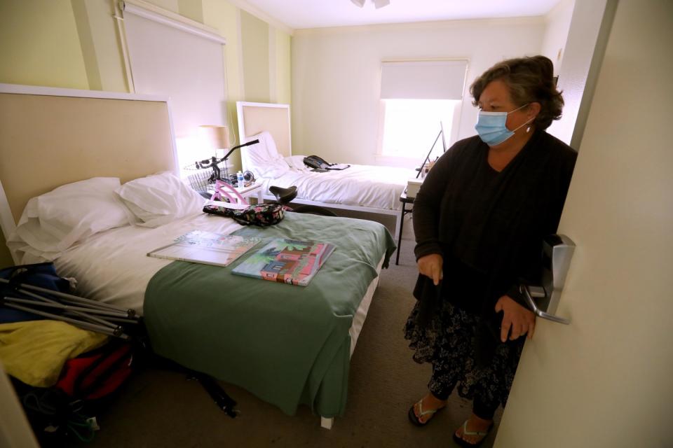 Wendy Brown, 58, enters her room at the Cadillac Hotel in Venice on June 1, 2020.