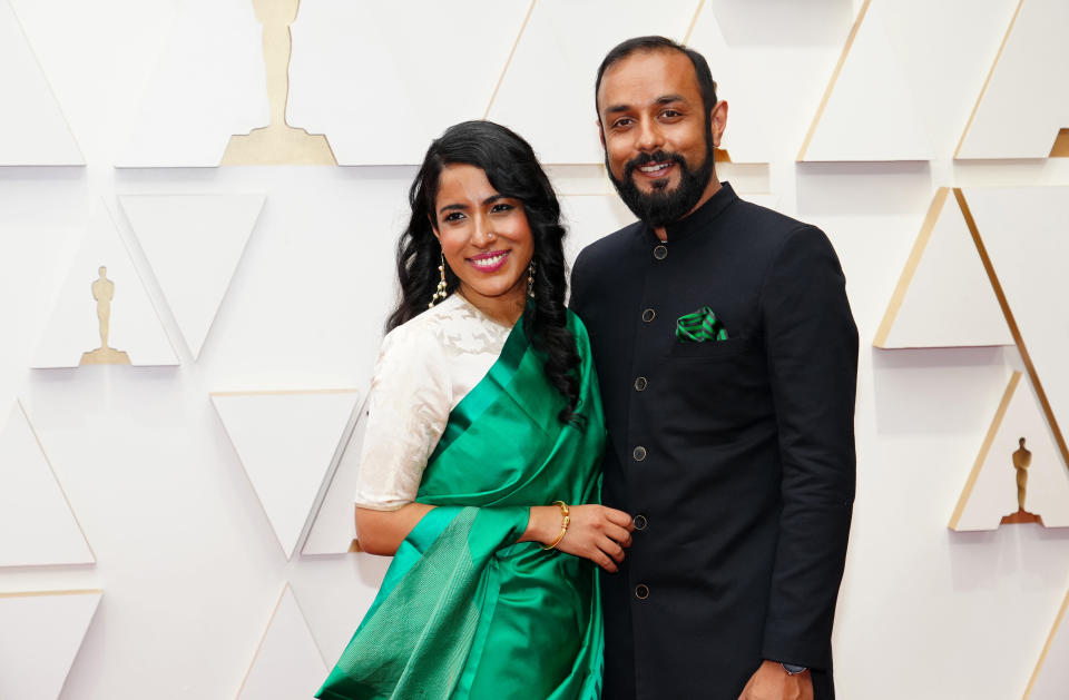 (L-R) Rintu Thomas and Sushmit Ghosh attend the 94th Annual Academy Awards on March 27, 2022 in Hollywood, California.
