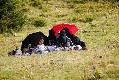 Tourists from the Middle East enjoy along the Prokosko Lake near Fojnica, Bosnia and Herzegovina, August 20, 2016. Picture taken August 20, 2016. REUTERS/Dado Ruvic