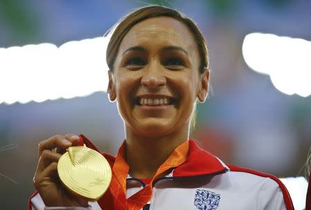 Jessica Ennis-Hill of Britain presents her gold medal after winning the women's heptathlon during the 15th IAAF World Championships at the National Stadium in Beijing, China in this August 24, 2015 file photo. REUTERS/Damir Sagolj - RTX1PF6I