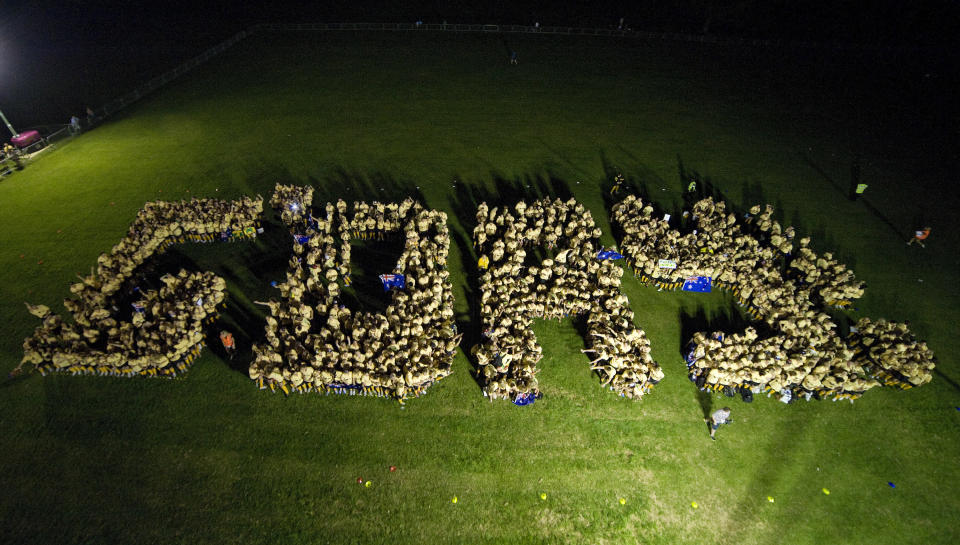 Australian sports fans and two-time Olympic Medallist Geoff Huegill spelling out the word G'Day on Clapham Common in London, Wednesday, July 25, 2012. The fans attempted to break the Guinness World record for The Most People Wearing The Same Full Team Kit.